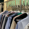Photo of pressed shirts at a dry cleaners.