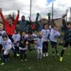 Chestnut Hill Youth Sports Club - Coach and team jumping for joy